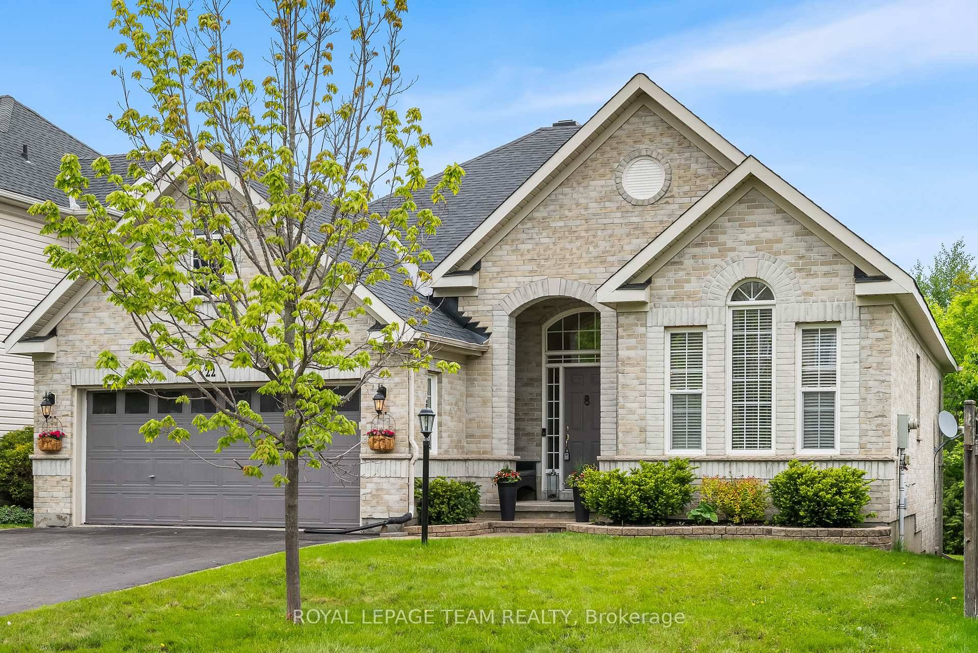 Welcome to this beautiful all brick bungalow situated in the desirable Stoneridge community.