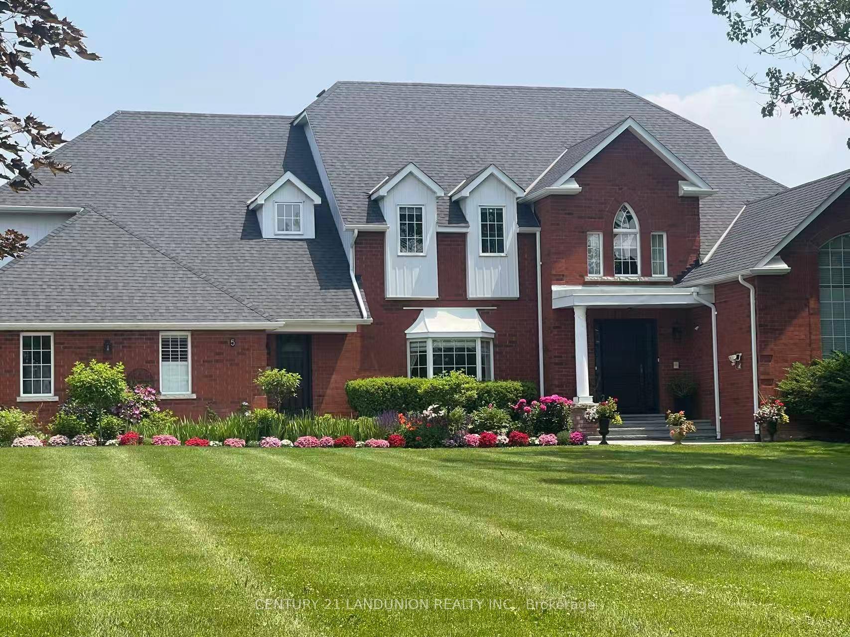 Nestled on a private 2 acre lot, this beautiful two storey detached home offers the perfect balance of comfort, privacy, and convenience.