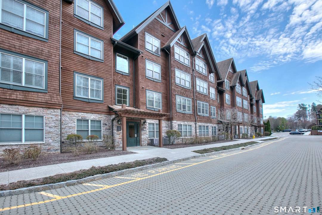 Experience elevated lakeside living in this stunning two level penthouse overlooking Candlewood Lake.