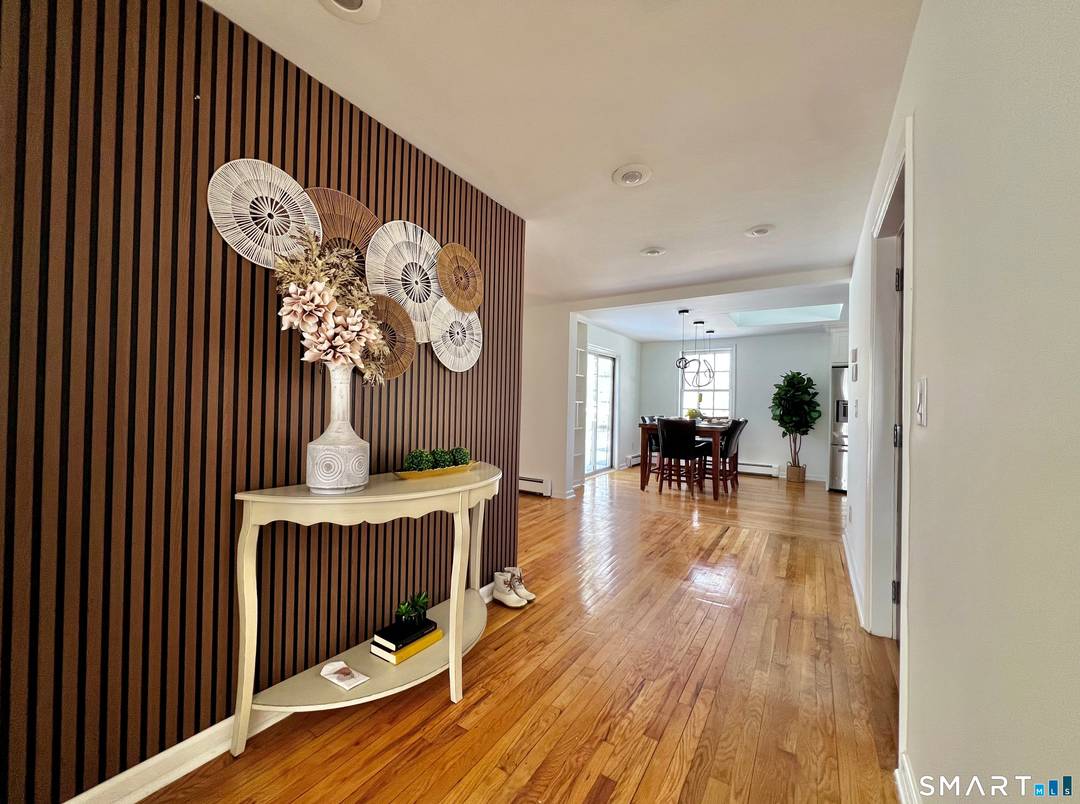 This Bright and Spacious Property is situated in a Prime Location and features numerous windows, sliding doors, and a kitchen skylight.