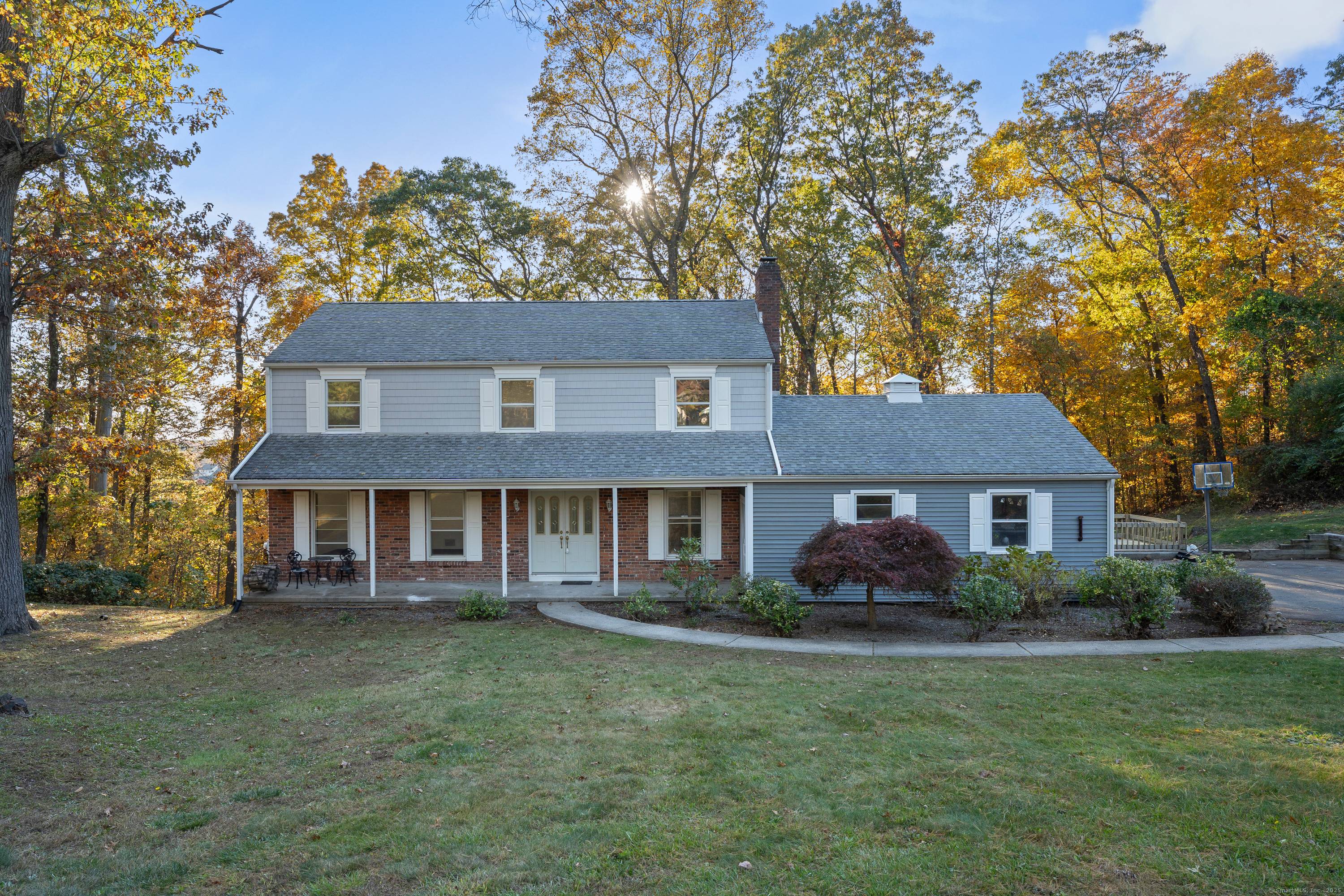 This well maintained colonial house features classic architecture with a spacious and inviting exterior.