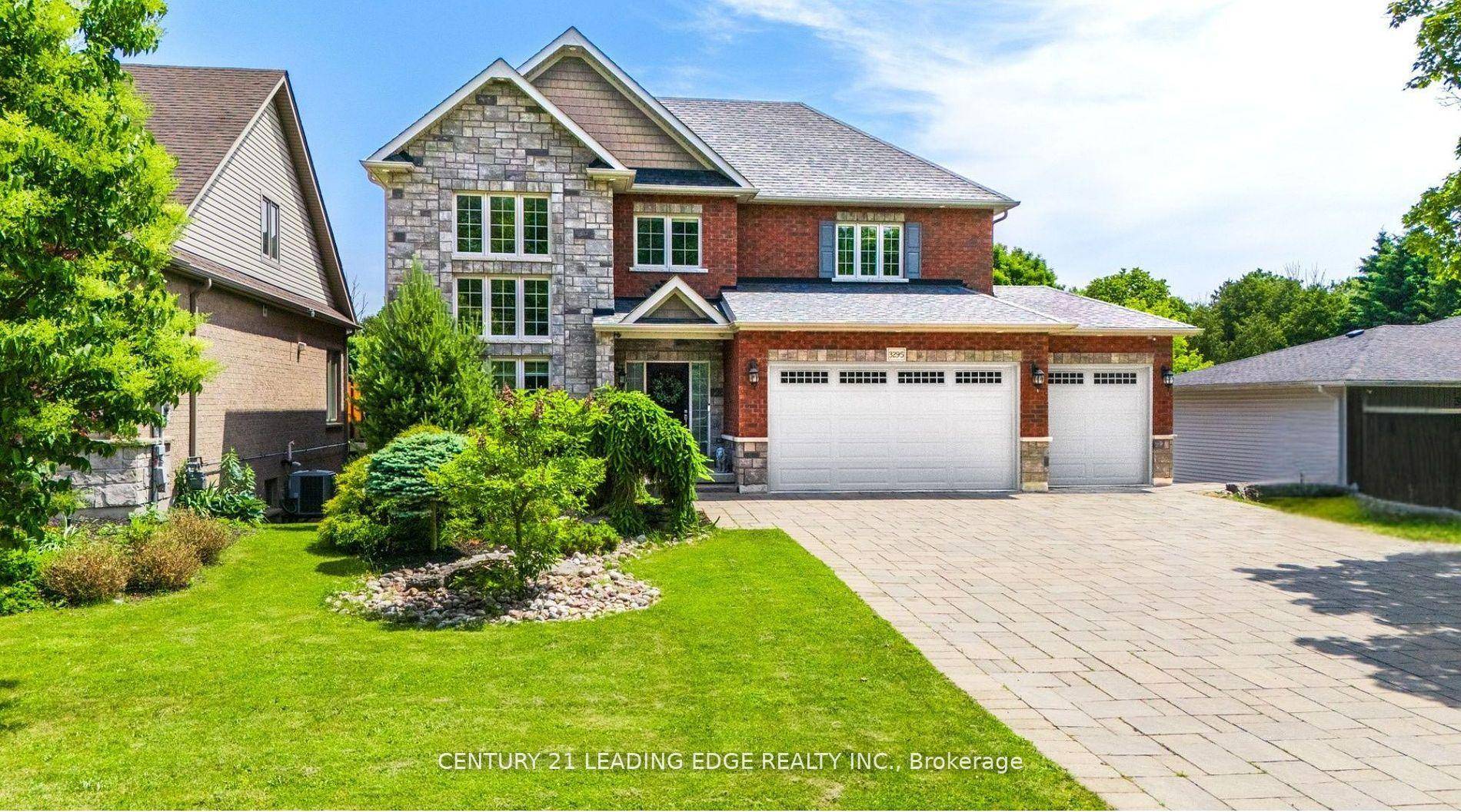 This custom built 2 storey home is set on a deep lot on the desirable Tooley Rd.