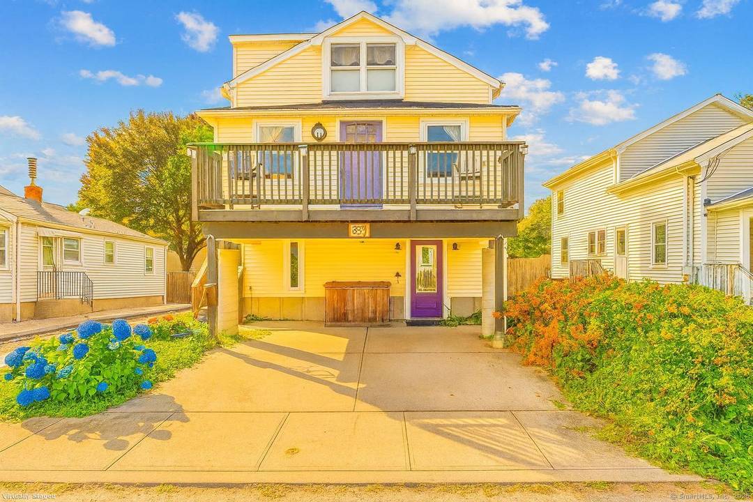 A home that redefines coastal living in Milford's coveted Point Beach enclave.