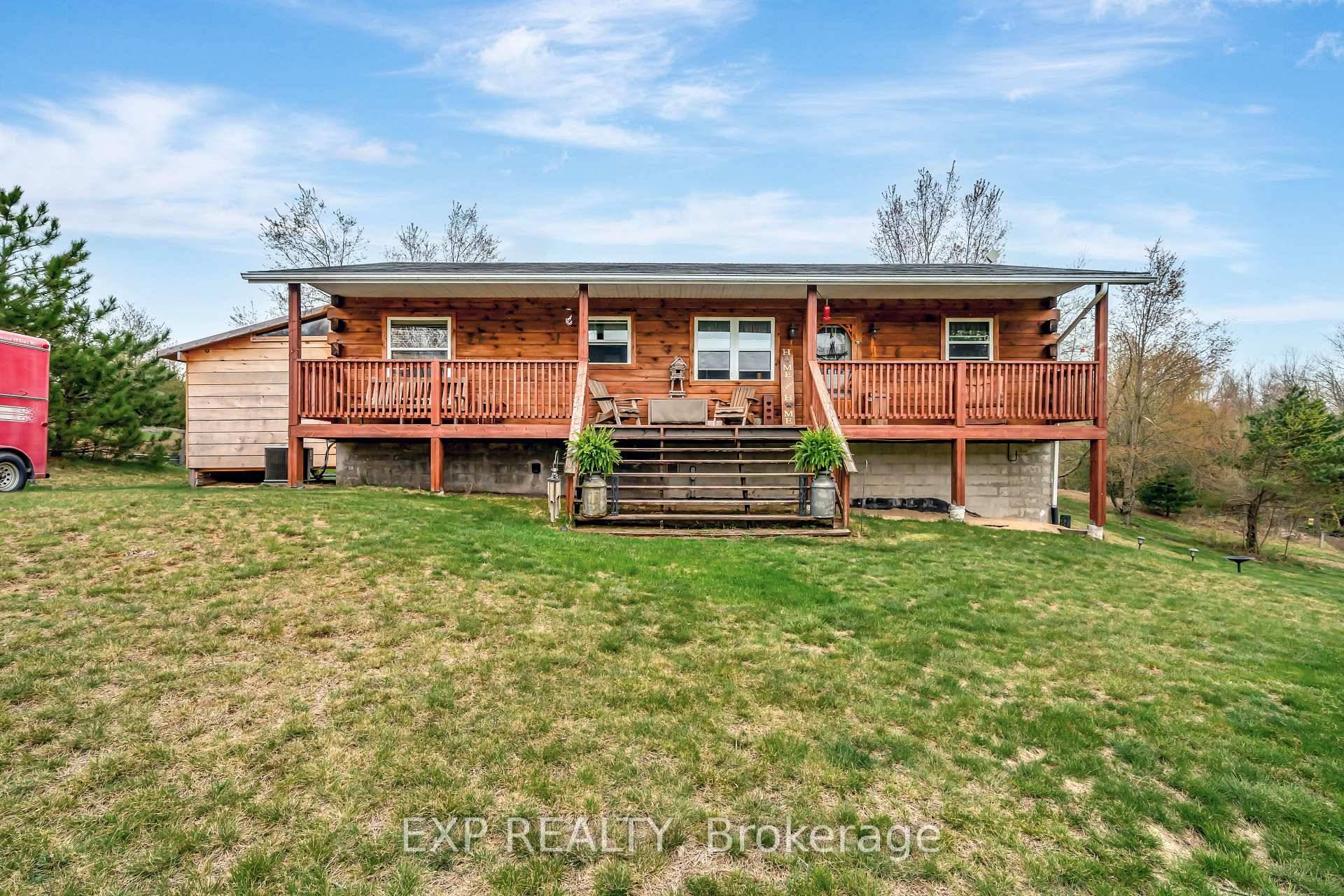 A little slice of heaven nestled on 29 acres, and surrounded by forest, sits this handcrafted log home with it's rustic beauty and timeless charm.