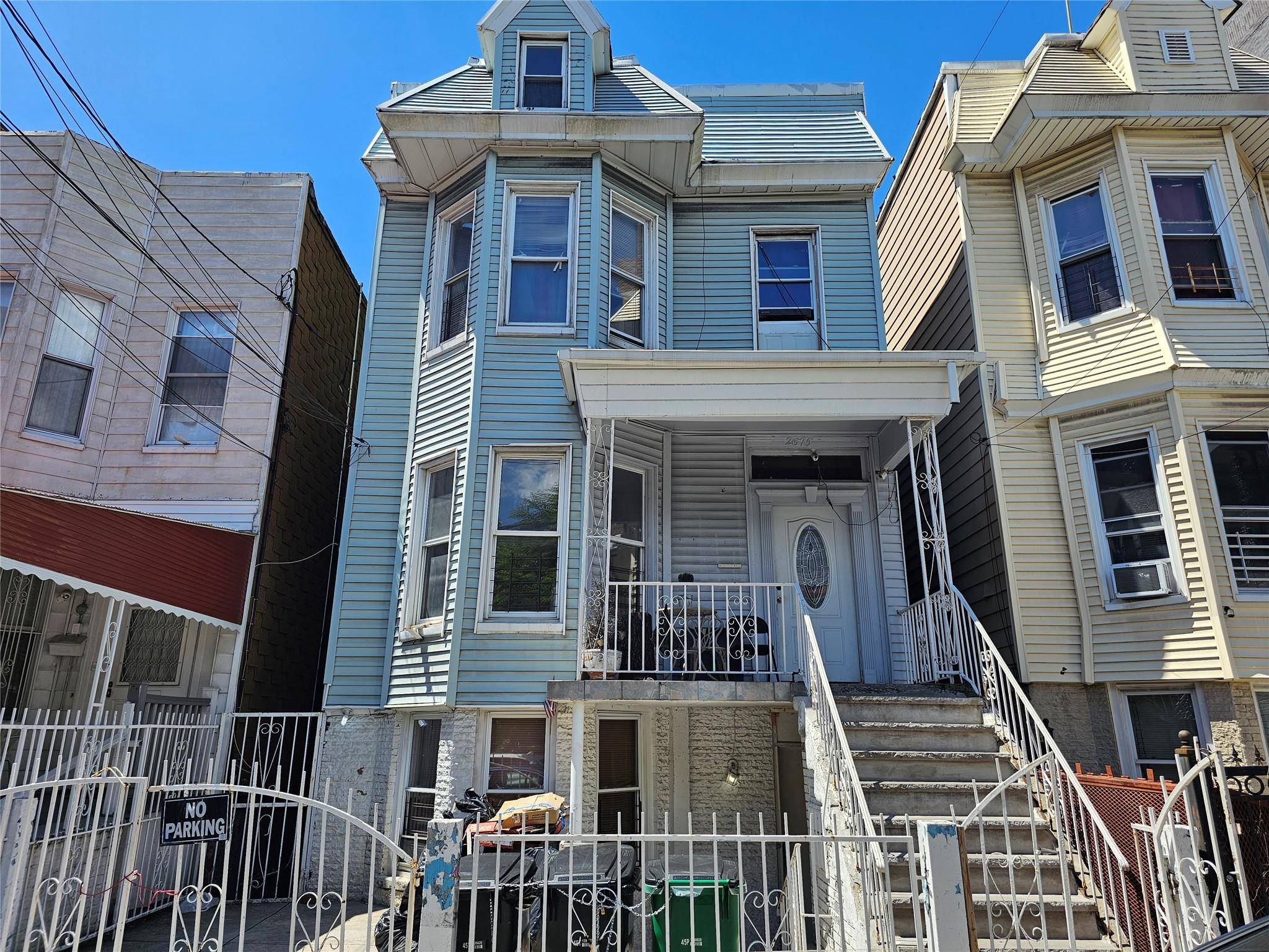 Multi family home in the Fordham section features one 4 bedroom apt and two 3 bedroom apts with an unfinished walkout bsmt.