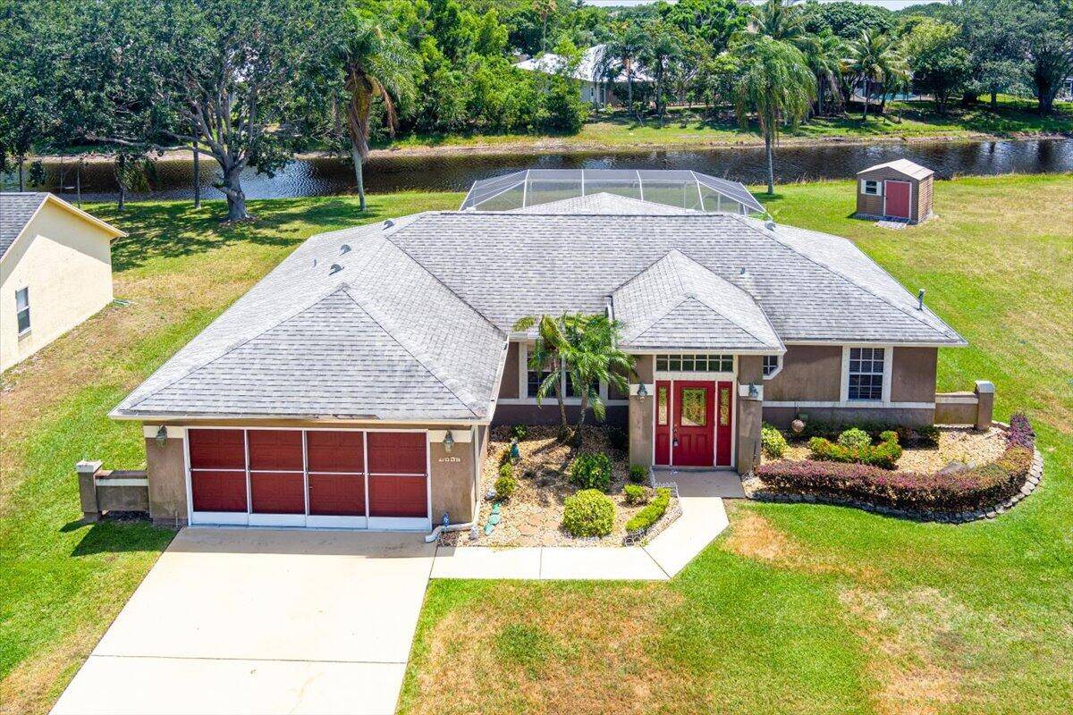 TOP LOCATION ! Beautiful Three Bedroom, Two Bath, Two Car Garage home with Screened POOL, Porch and Patio !