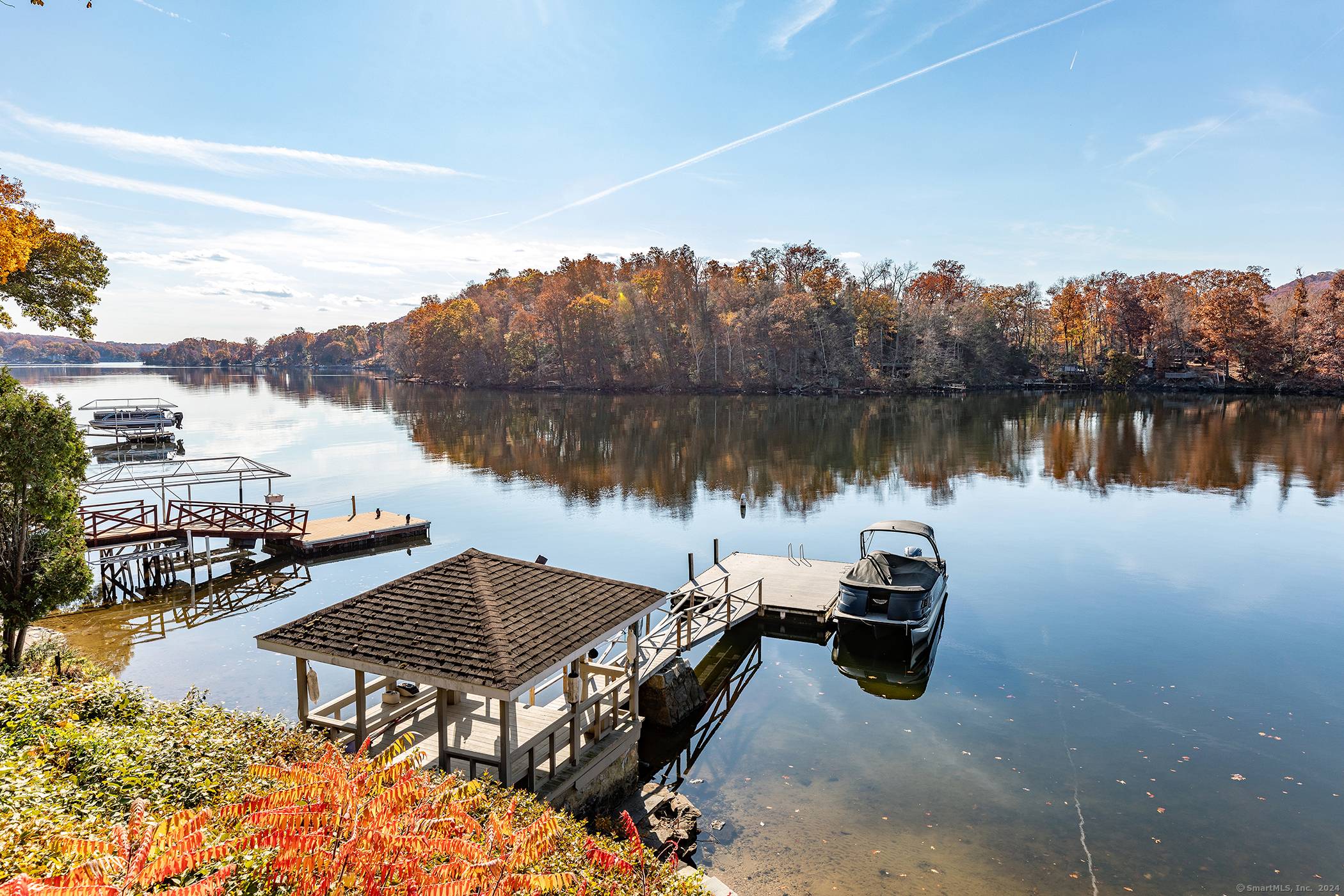 Exceptional Waterfront Estate in Candlewood Shores w 115 ft frontage, renovated Main House Guest House completed 2024 showcases the ultimate in Lake Front Living on Candlewood Lake.