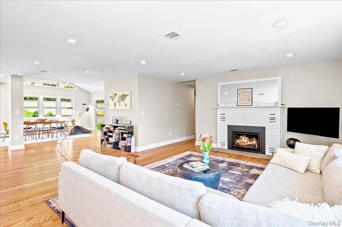 Step into this impeccably renovated Mid Century Modern retreat where walls of windows frame sweeping views of both Hook Mountain and the distant Hudson River.
