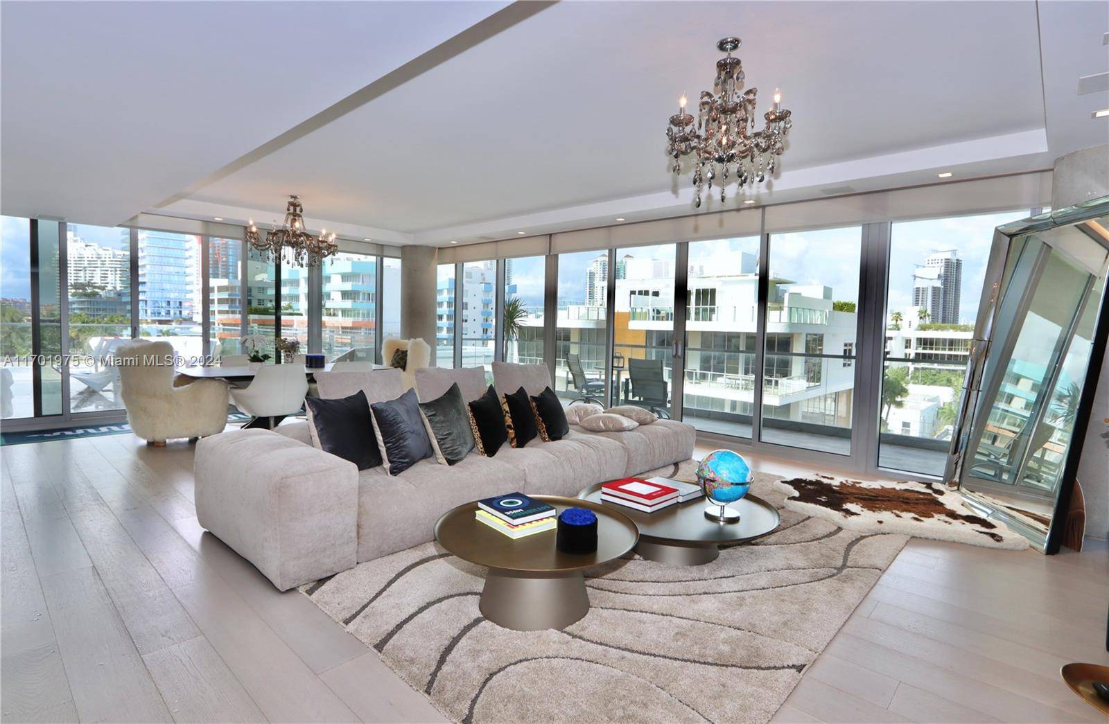 This Extraordinary PH is a one of a kind flow through residence designed by renowned architect Enrique Norten w interiors by Busta Studio.