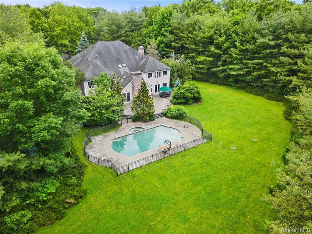 Tucked away at the end of a quiet, picturesque cul de sac in the coveted Purchase community, this exceptional home sits on nearly two beautifully landscaped acres that make a ...