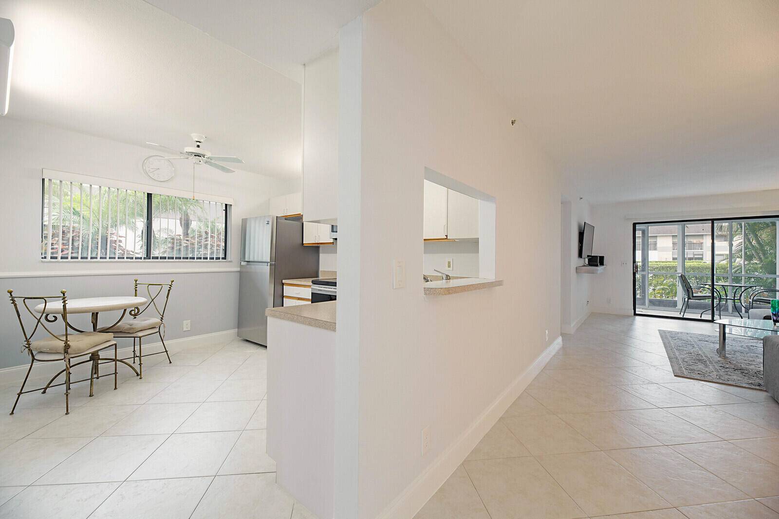 Beautifully Renovated 2 2 condo on the first floor with an enclosed patio and access to parking area.