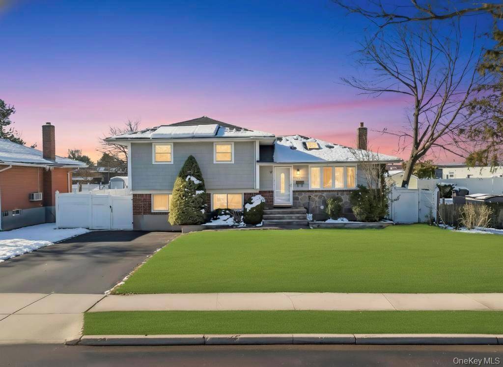 Welcome to this charming and spacious residence located in Hicksville.