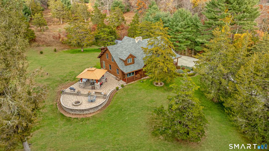 Welcome to this custom log home set on 3.