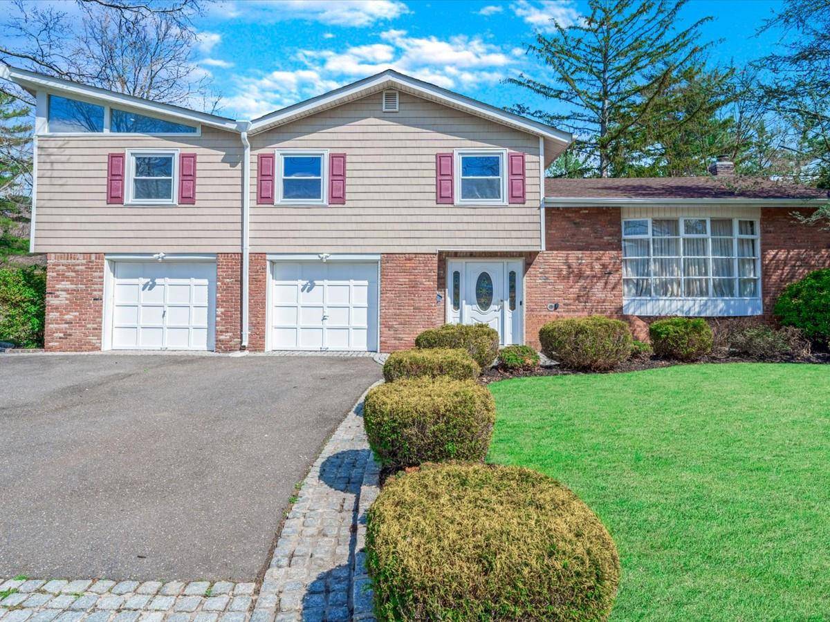 Welcome to 36 Red Spring Lane in charming Glen Cove a beautifully renovated 4 bedroom, 3.