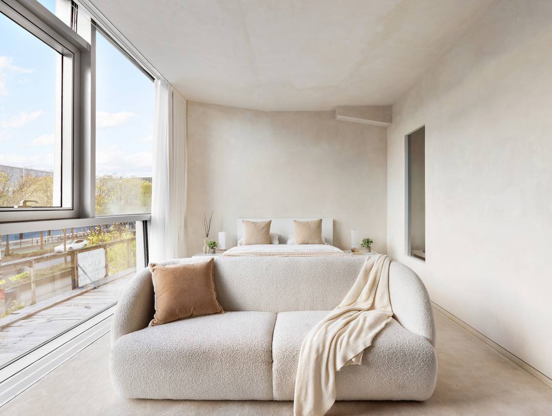 A Stunning Designer Home with 12ft Ceilings and Open Views at Jean Nouvel's Architectural Masterpiece Delivered Fully Furnished.