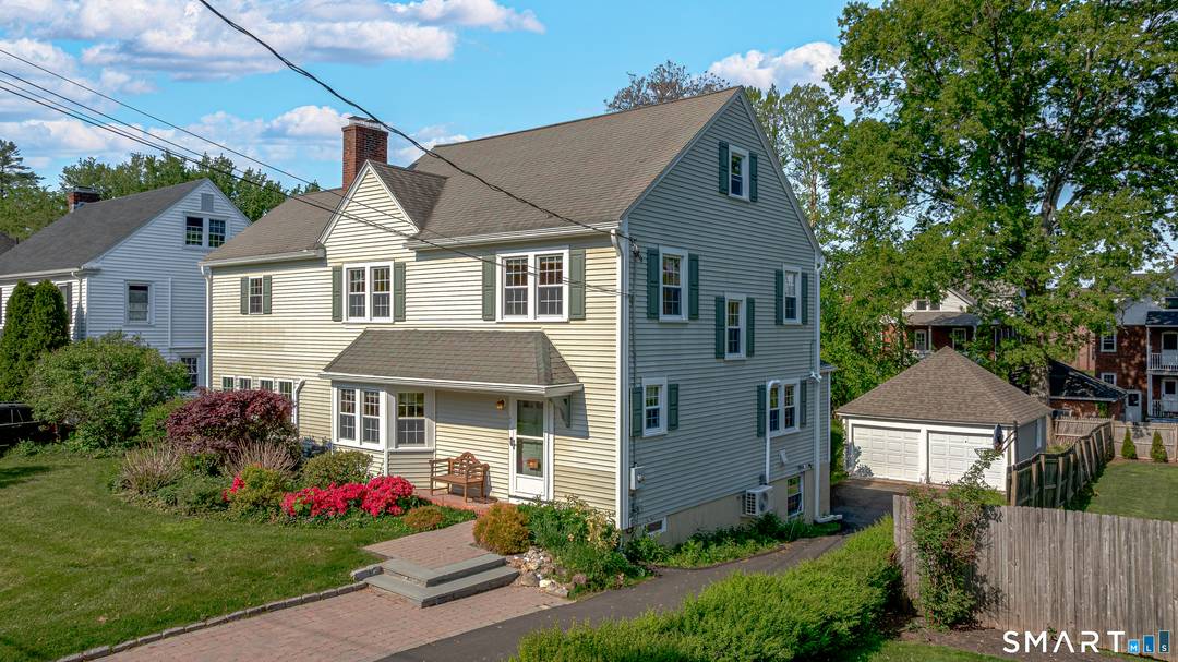 Welcome to this timeless West Hartford Colonial where classic charm meets modern functionality.