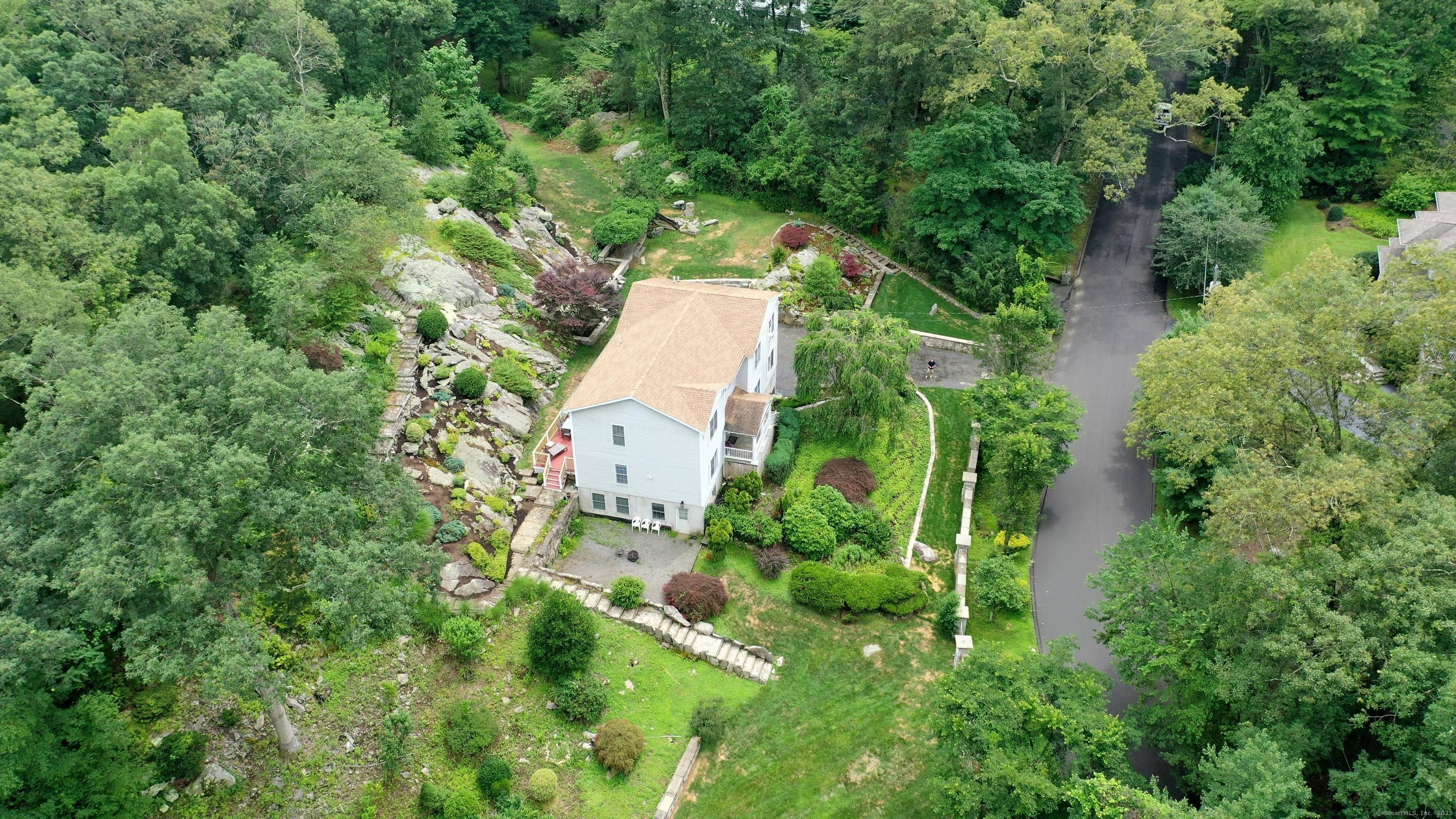 Set on over 2 acres of private, park like property, this 4 bedroom Colonial blends classic charm with modern comfort.