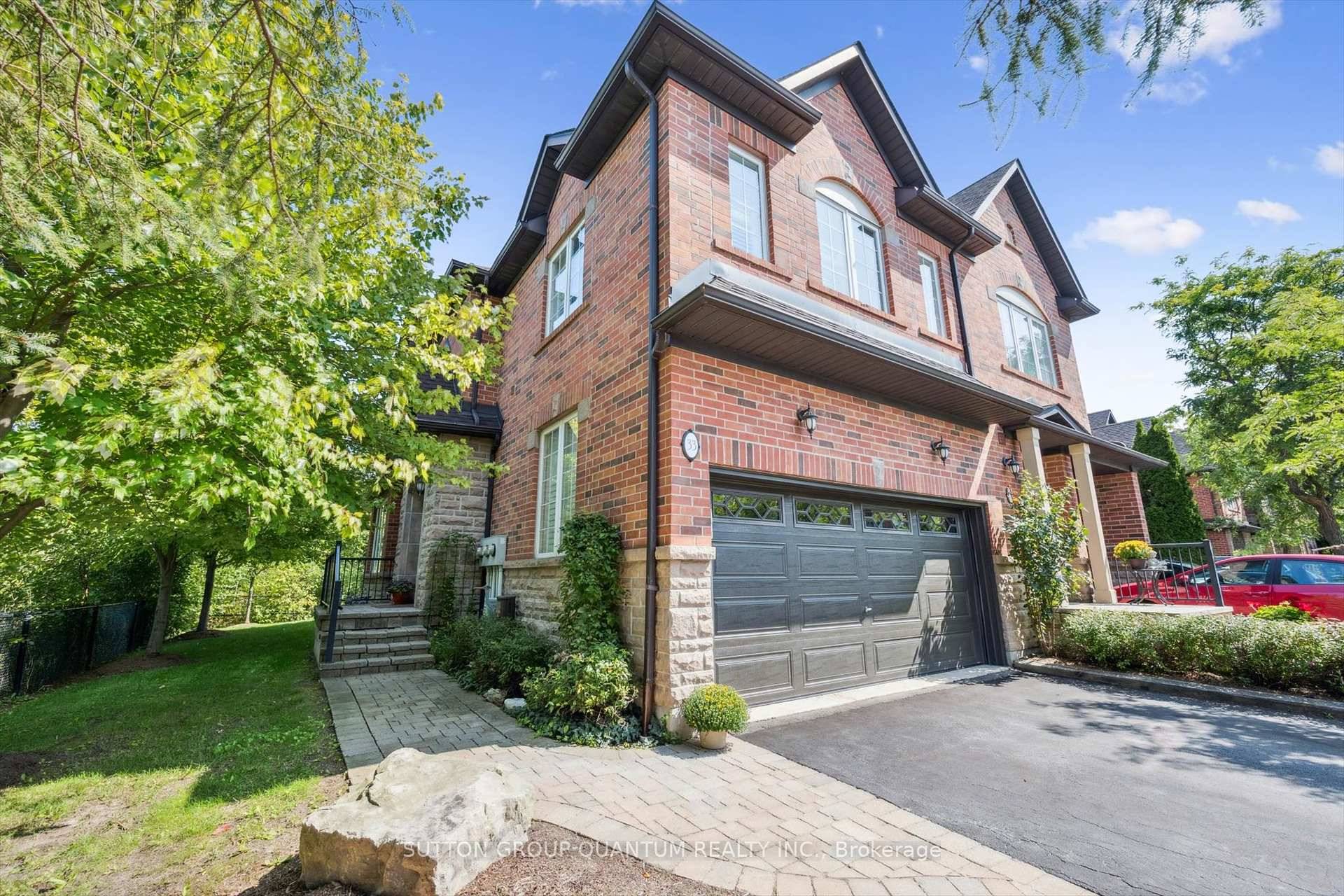 ONE OF A KIND COURT LOCATION in the Brownstones, this end unit TH with rare 2 car garage offers complete privacy and spectacular nature views.