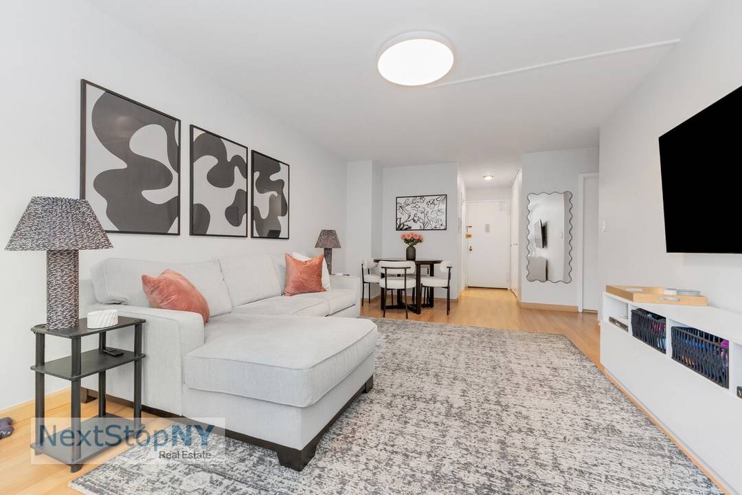 This light filled home offers eastern city views, a spacious living room and bedroom, and a clean, modern kitchen featuring new countertops and stainless steel appliances.