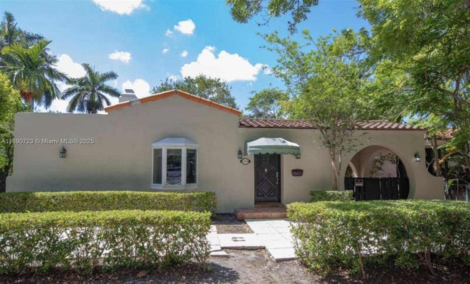 Step into timeless elegance in this classic Miami Beach home radiating charm and endless potential.