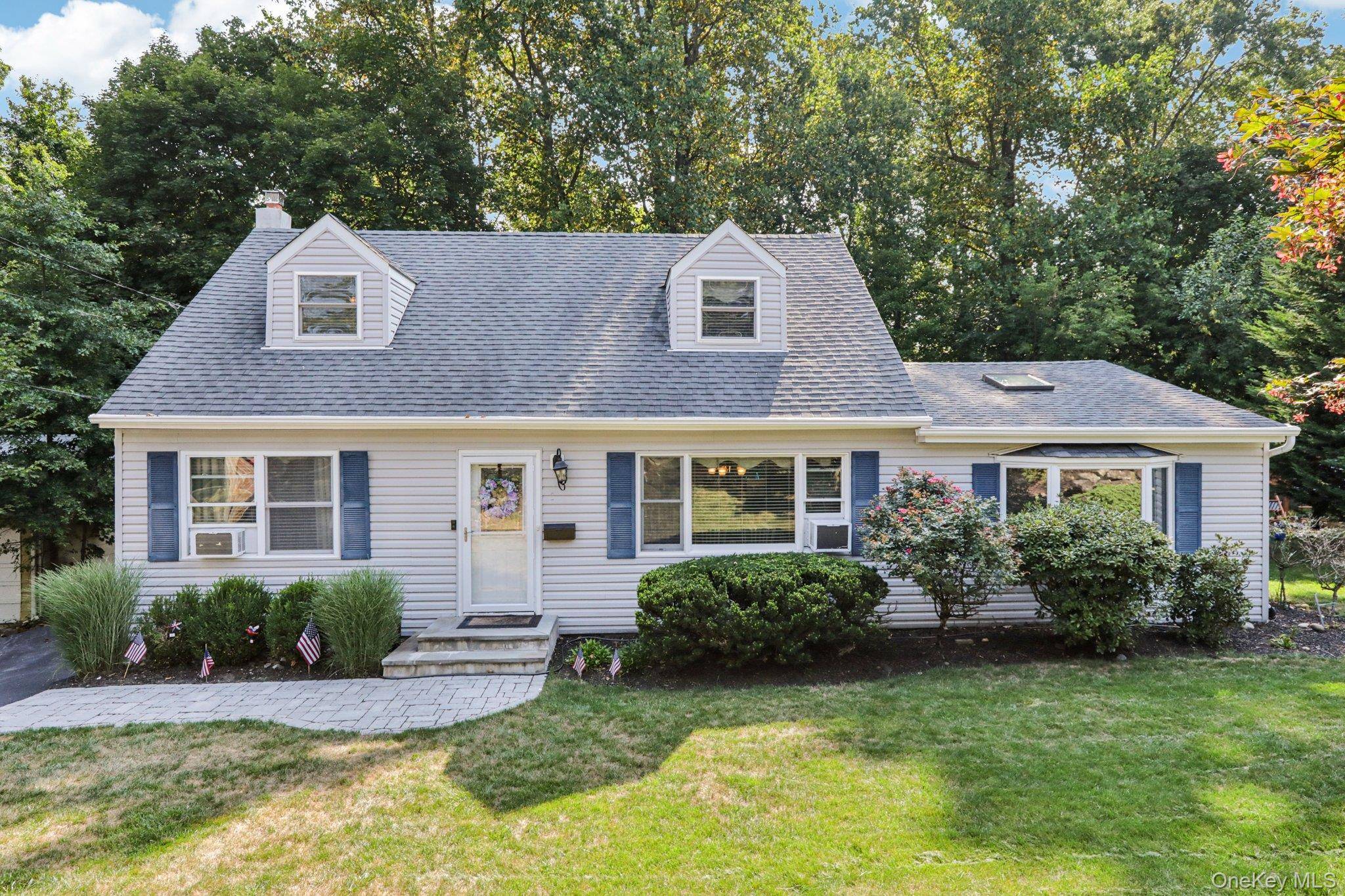 Charming 4 Bedroom, 2 Bath Cape Cod This inviting home features an open kitchen with a large island, granite countertops, and high quality appliances, perfect for both cooking and entertaining.