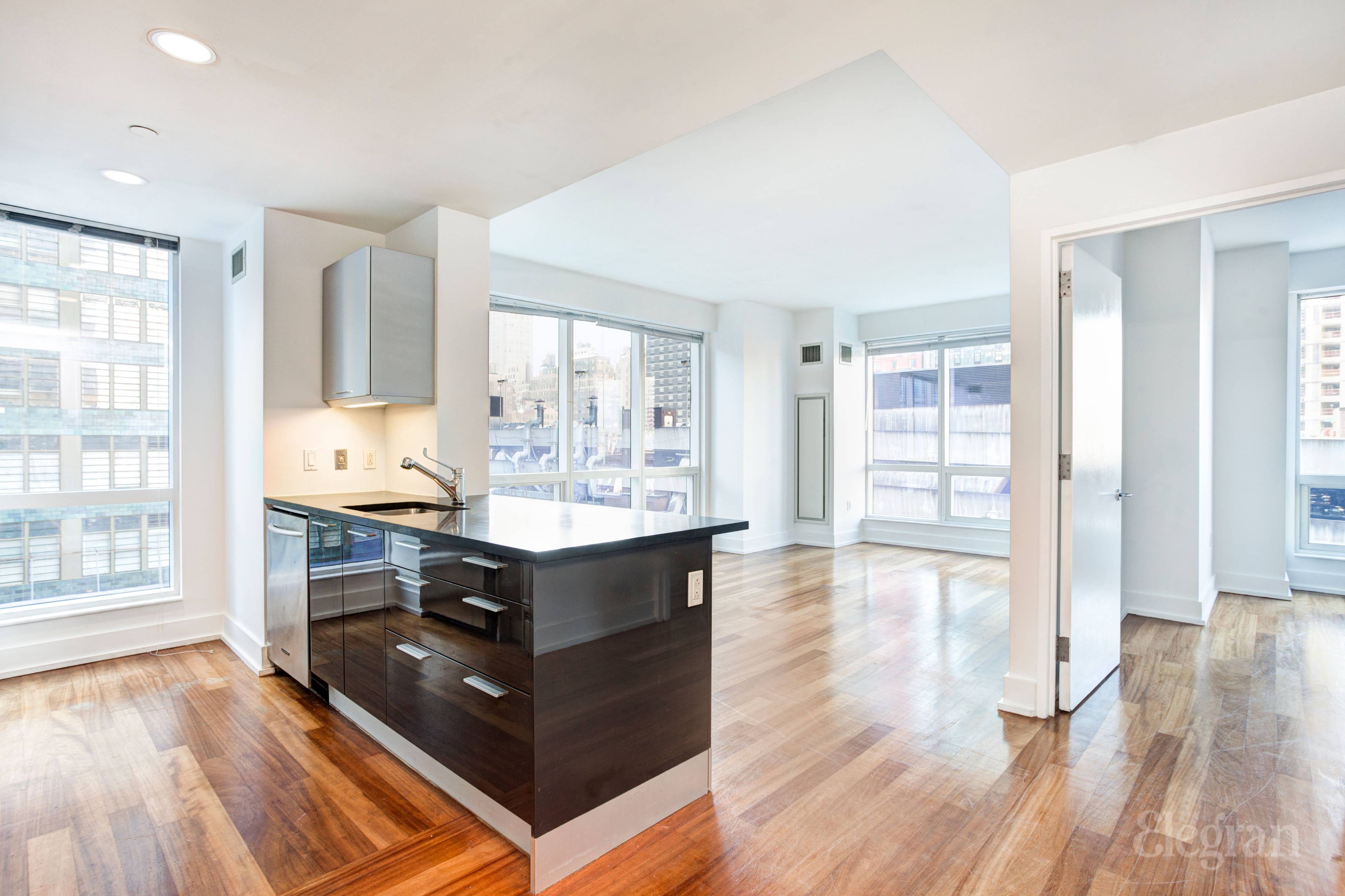 Sun blasted corner 1 bedroom unit in the Orion Condominium on West 42nd street.