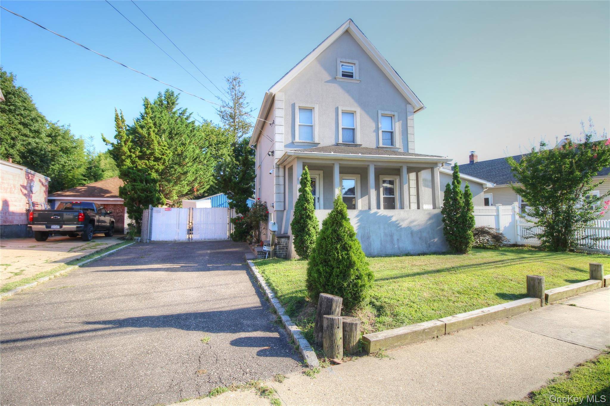 Introducing this Freeport Stucco Colonial on an oversized 60 x 139 foot property.
