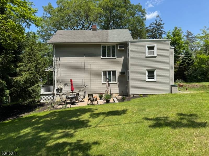 Own and Earn ! In This Two family on nice expansive corner lot of Maybe Lane and Boonton Ave.
