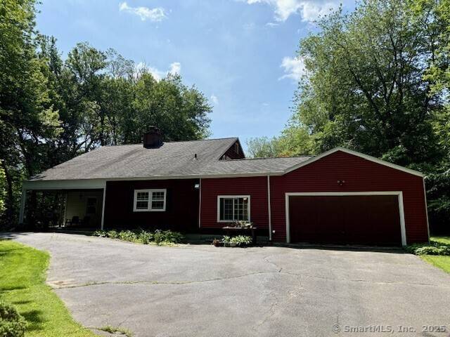 Charming Colonial nestled on a beautiful corner lot in sought after Woodbridge.