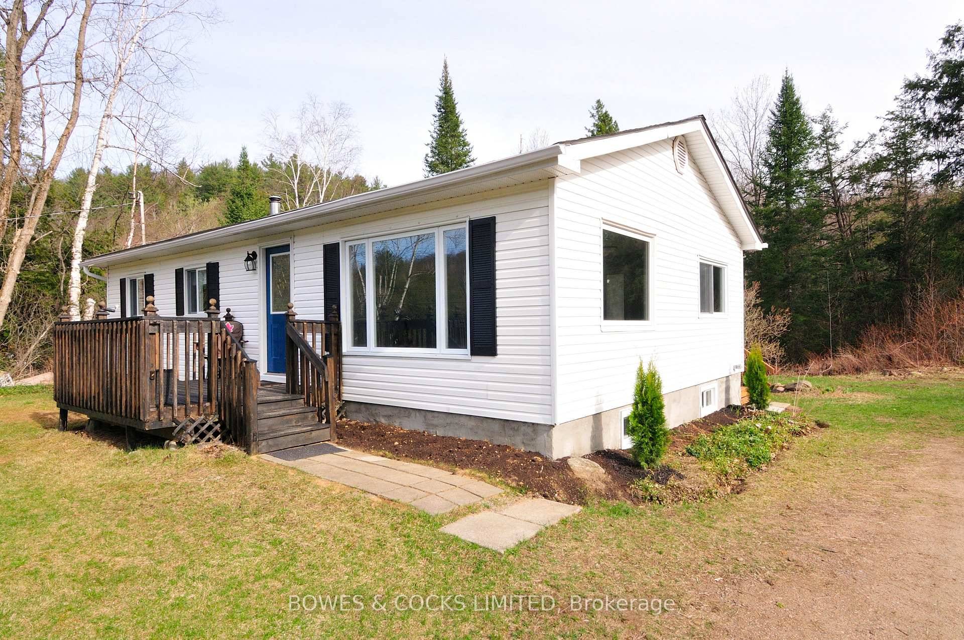 This 3 Bedroom, 2 Bath renovated bungalow sits on a private 1.