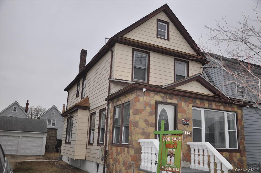 This fully renovated Colonial house with new plumbing, electrical, kitchen and bathroom fixtures also has new flooring and a finished basement with separate entrance.
