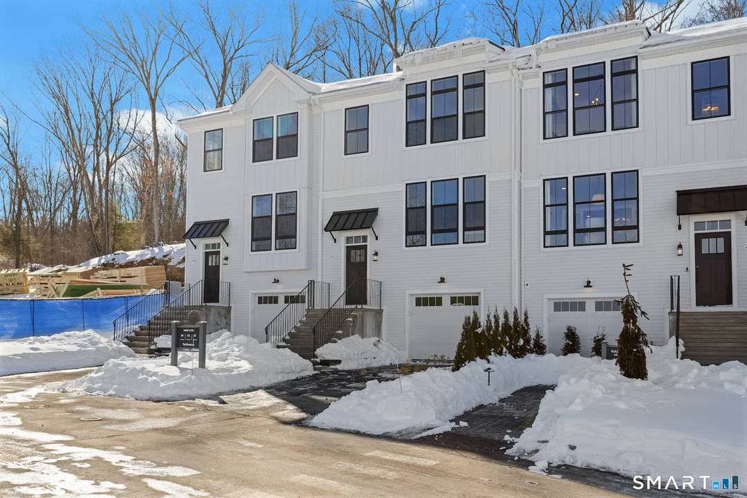 Welcome to the The Willows at Brookfield, an elevated, three story townhome offering exceptional space, light, and luxury design.