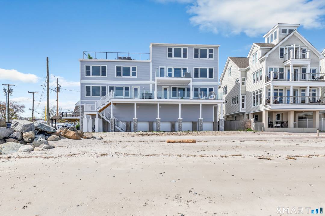 Beachfront Luxury with Panoramic Water Views !