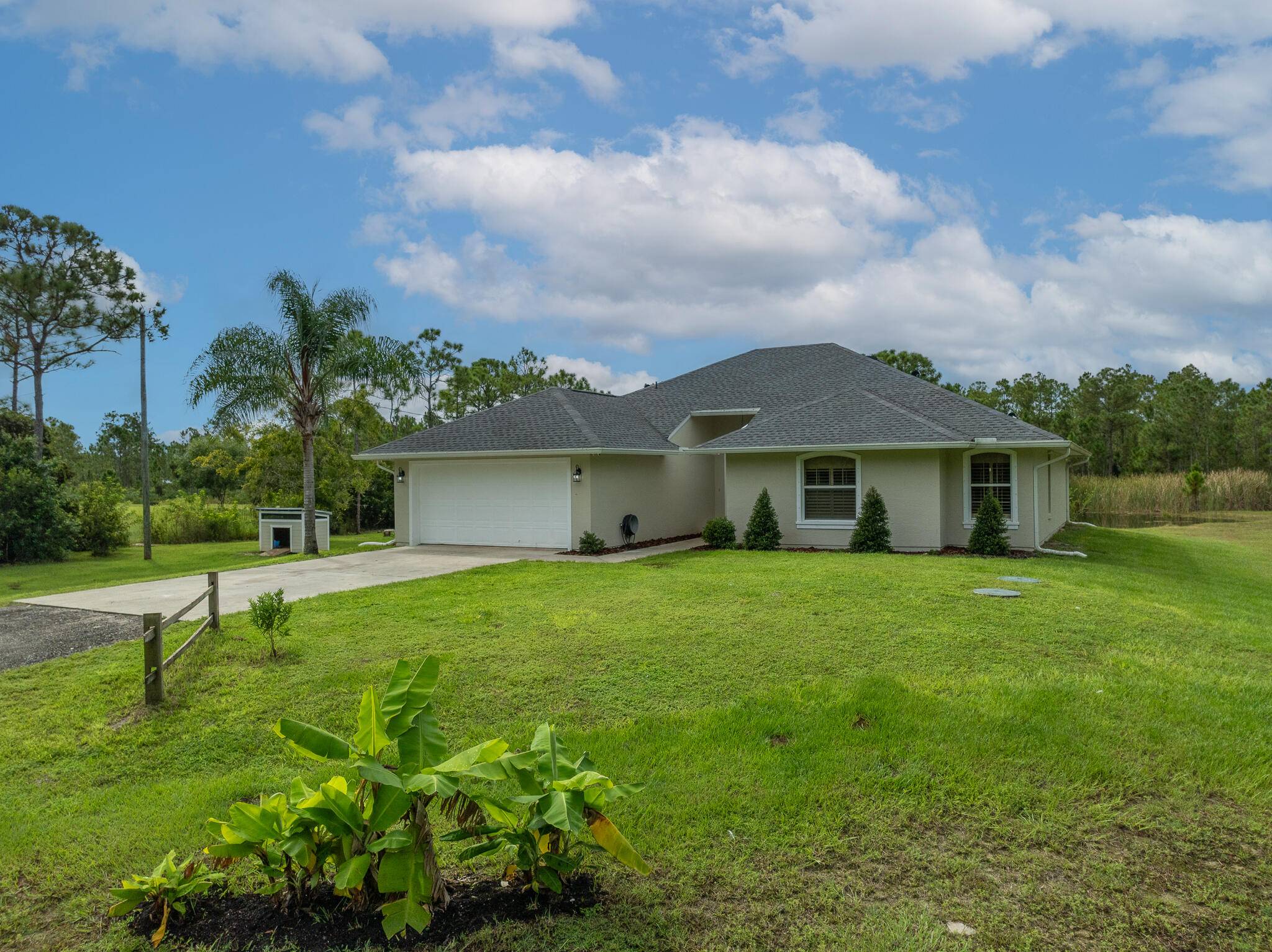 At nearly 5 acres, this well maintained piece of Florida paradise features a stocked pond with artesian well, chicken coops, and a fully fenced, one acre pasture ready for livestock ...