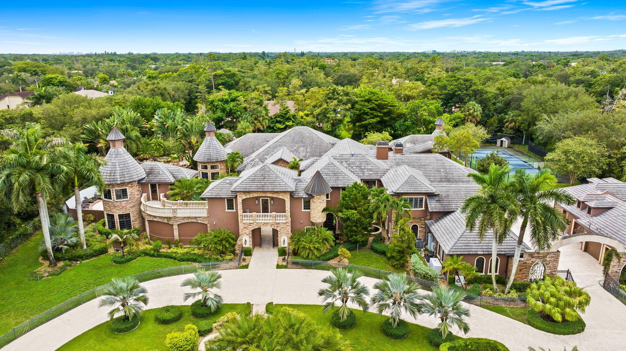 This exceptional estate, constructed by Terry Shore, is set on over 7 acres of fully fenced and gated grounds, offering a total of 22, 000 sq.