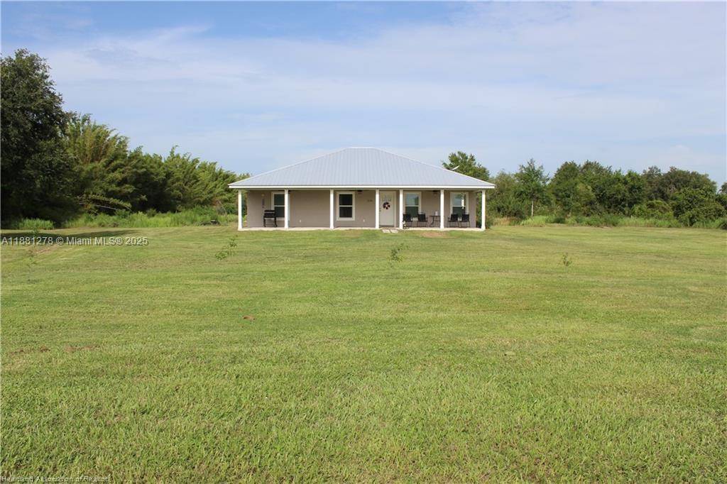 Enjoy peaceful country living in this beautifully crafted 3 bedroom, 2 bath home nestled on a spacious 5 acre lot.