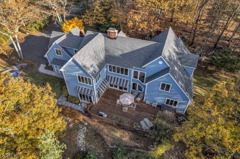 Amazing mountain and sunset views from this sprawling custom built home nestled and backed to protected land in the beautiful gated community of Smoke Rise.