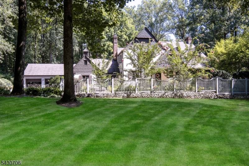 Down a long private road, this custom home offers peaceful privacy and luxurious living spaces on 3 acres in Harding Township.