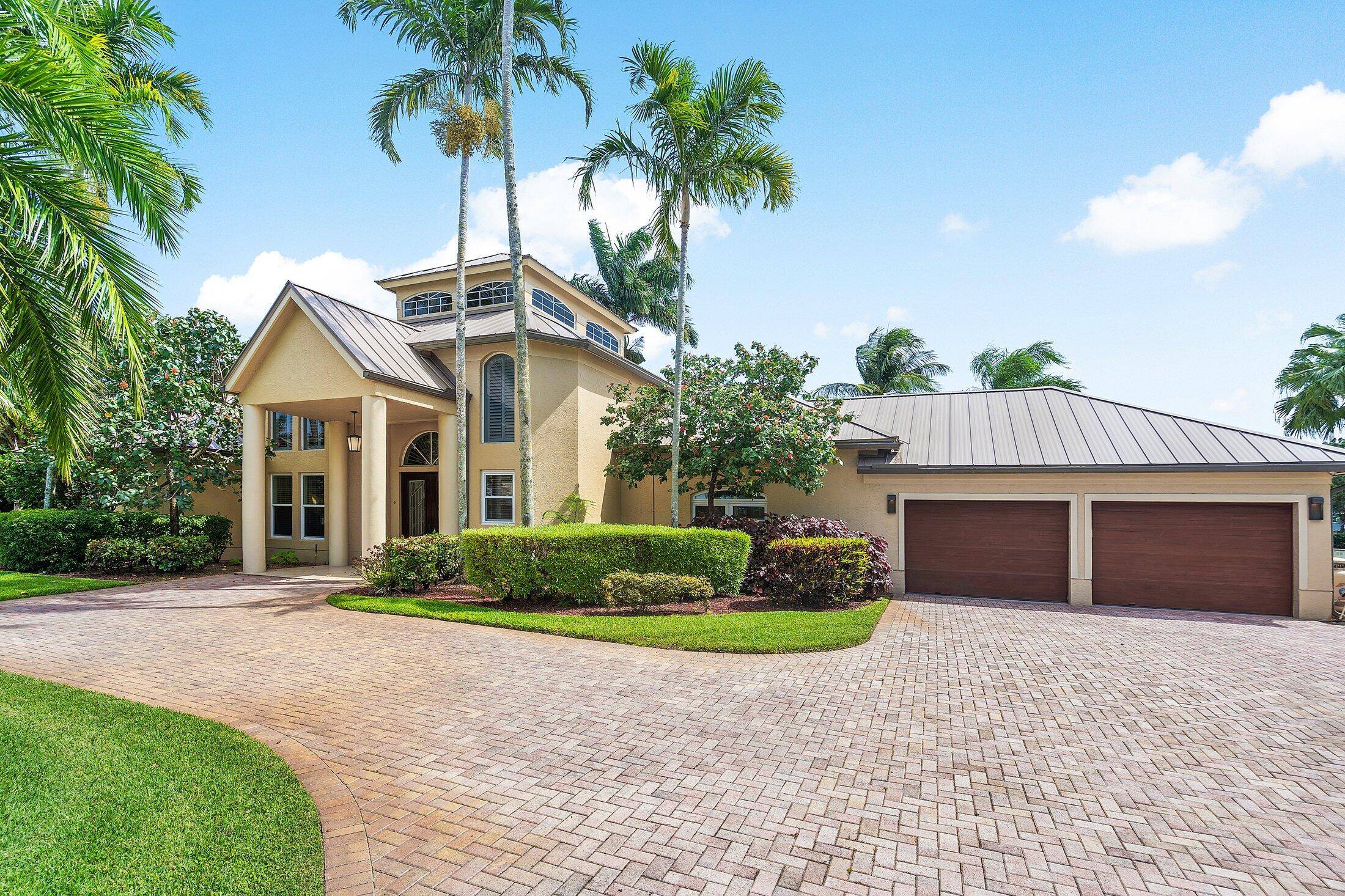 Tucked away on a quiet cul de sac in one of Palm Beach Gardens' most coveted locations, this well maintained 3 bedroom plus office, 3.