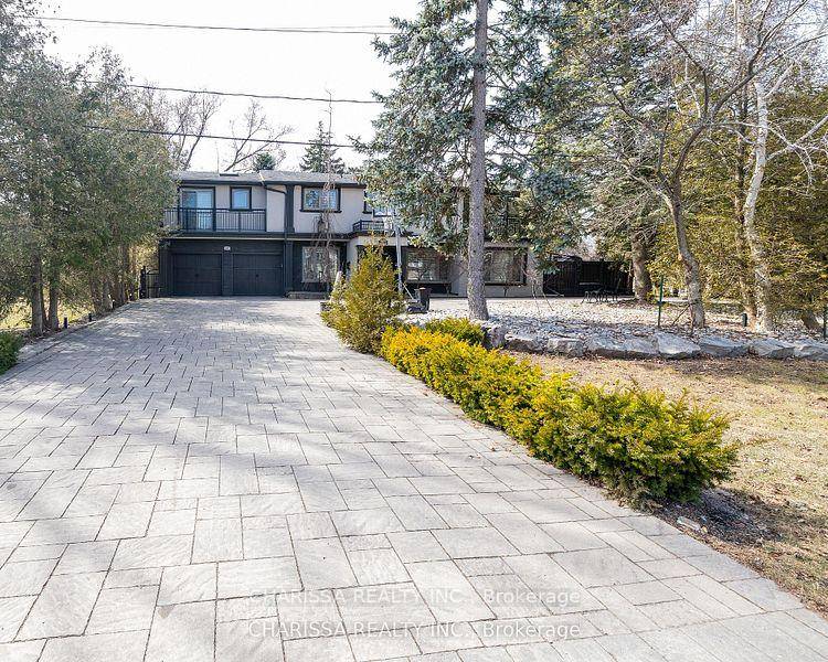 Situated on a prestigious street in sought after South Oakville, just steps from the lake, this architecturally designed custom home offers unparalleled luxury.