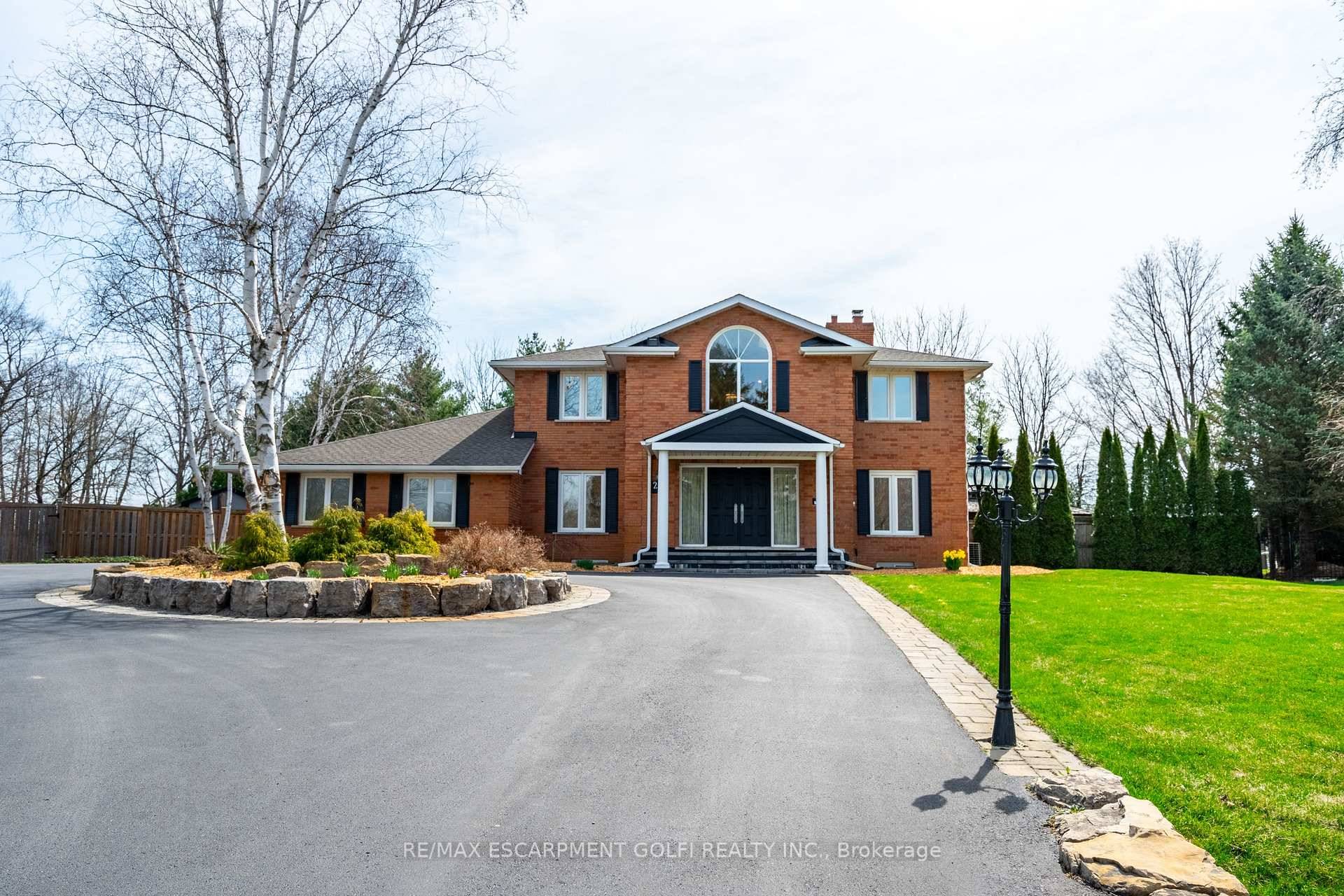 Situated on a beautifully manicured 0.