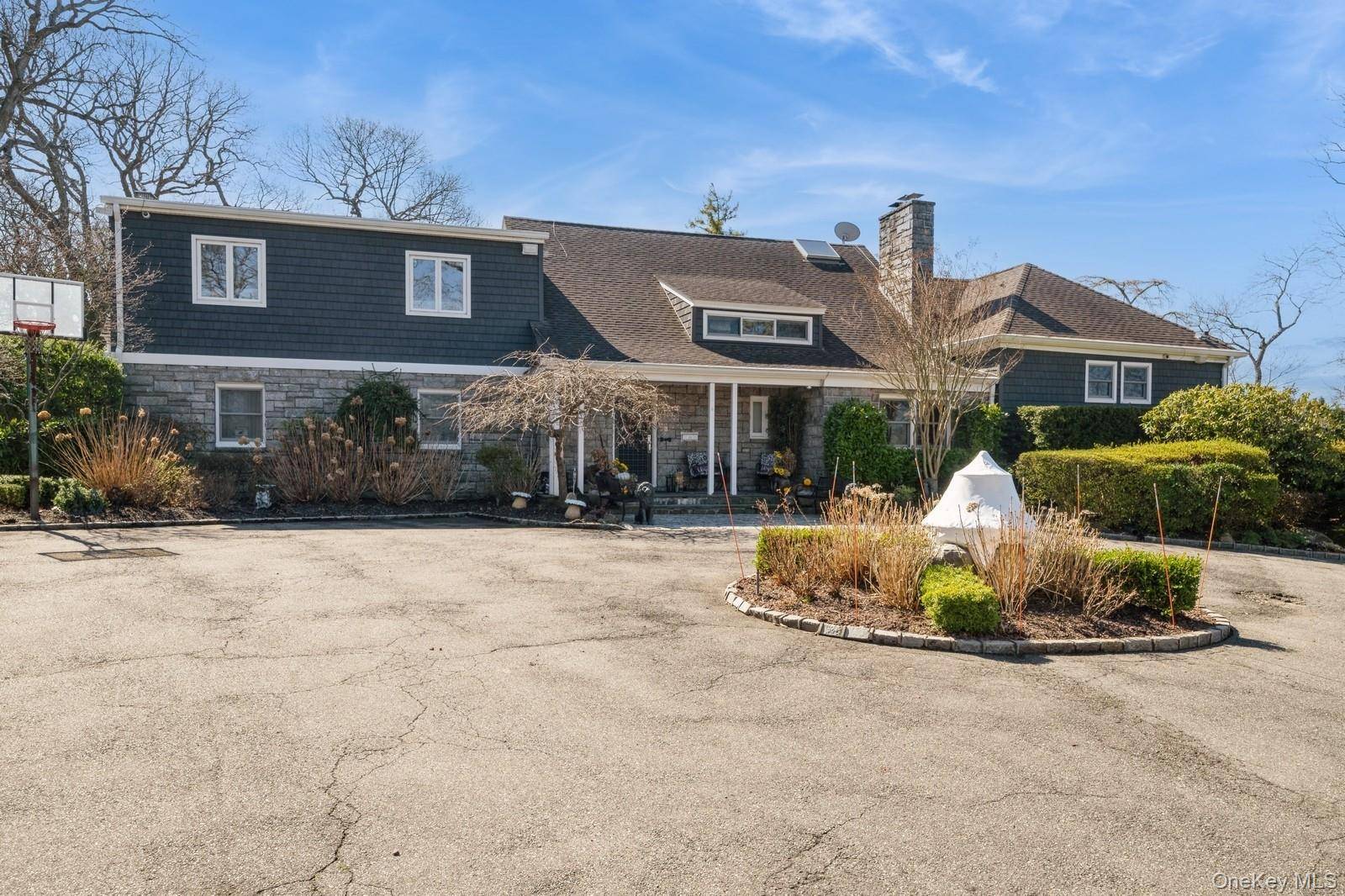 Step into this exquisite contemporary colonial estate, gracefully situated on over 1.