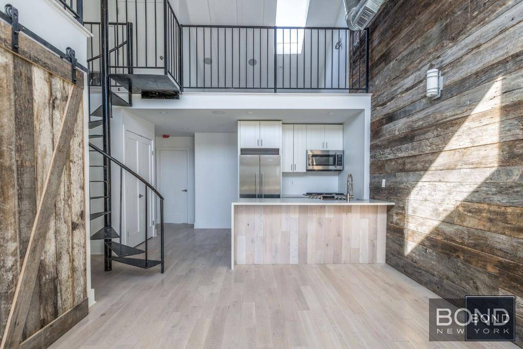 This is an absolutely stunning 2 level apartment loaded with light, high ceilings, style and all the comforts of a home !
