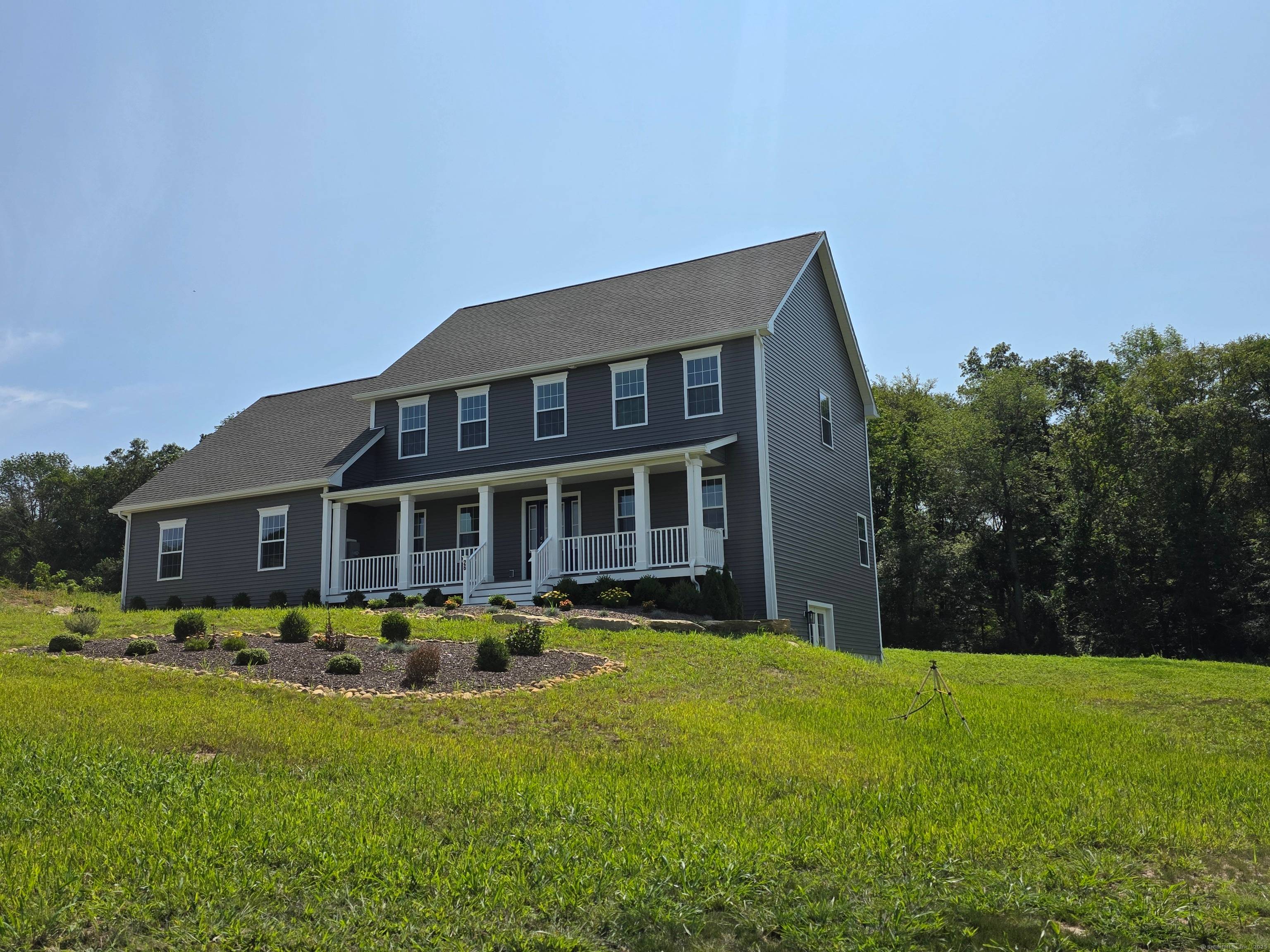 A Masterpiece of New England Elegance and Modern Comfort Perched gracefully within the prestigious Farm View Estates, this quintessential New England Colonial offers timeless sophistication and sweeping pastoral vistas.