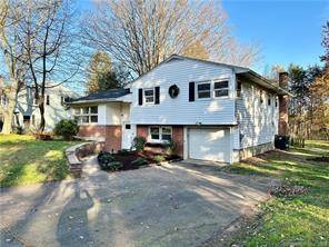 Nestled within a tranquil suburban neighborhood, this deceivingly spacious updated split level home beckons with its unassuming exterior.