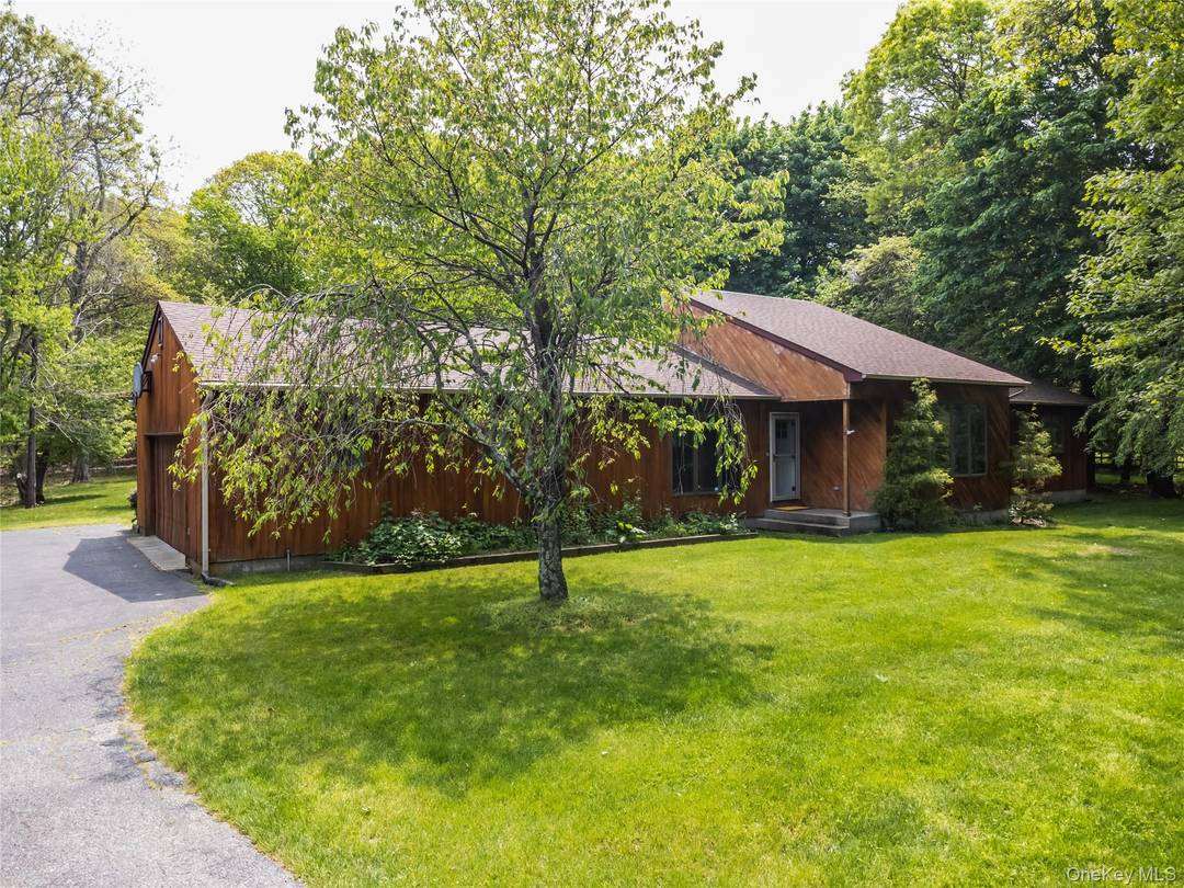 Discover your extraordinary dream home at 67 Bellview Avenue in Center Moriches !