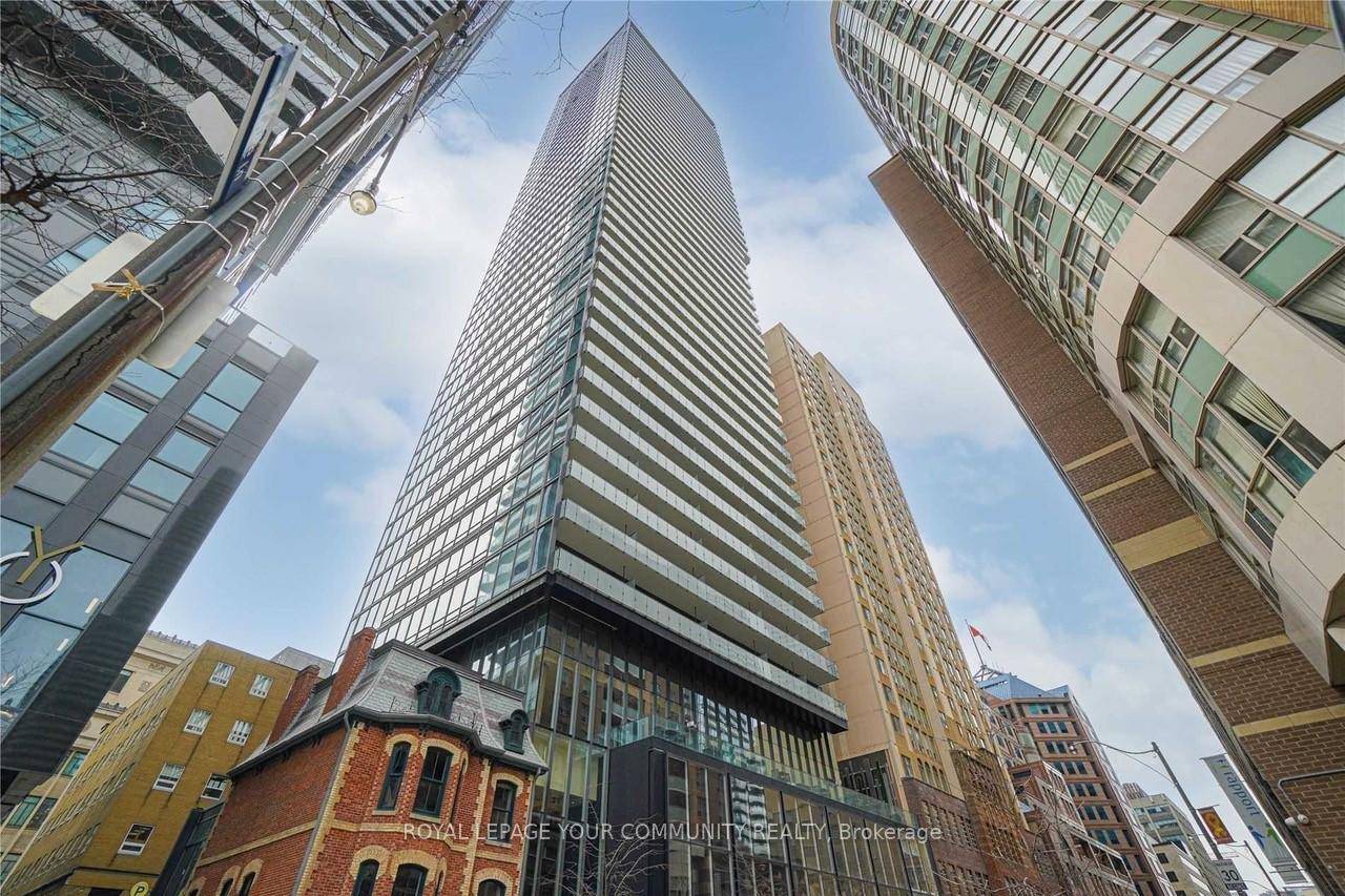 Karma Condos. 1 Bedroom Den Suite, Designer Kitchen Cabinetry With Built In Appliances amp ; Stone Counter Tops.