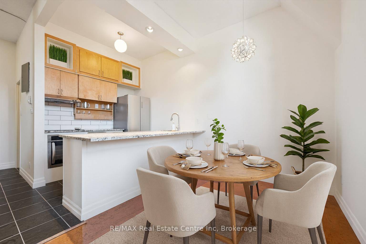 Welcome to your downtown Guelph sanctuary at 202 200 Woolwich St charming 3 bdrm, 2 storey loft condo nestled in one of the city's most exclusive residential buildings !