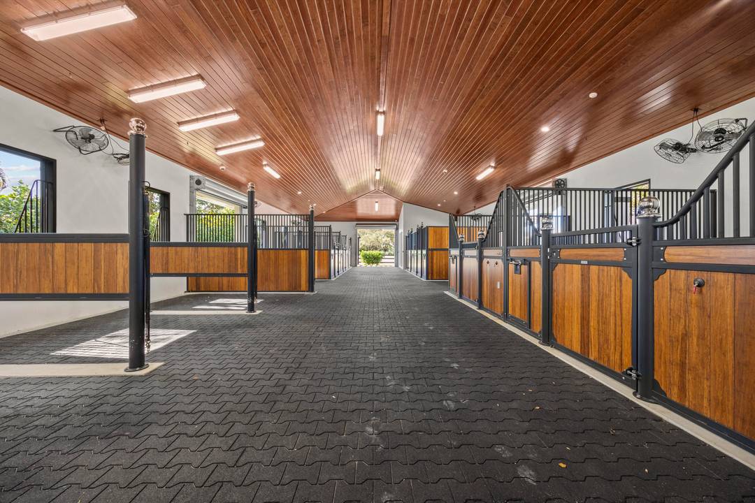 Exceptional wow factor equestrian estate available for seasonal lease, offering a premier Wellington experience that includes a remodeled 4 bed 3 bath house, two barns featuring 11 stalls total with ...