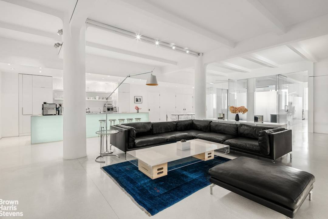 A private elevator opens directly into this full floor Chelsea loft, where scale, light, and separation come together with rare precision.